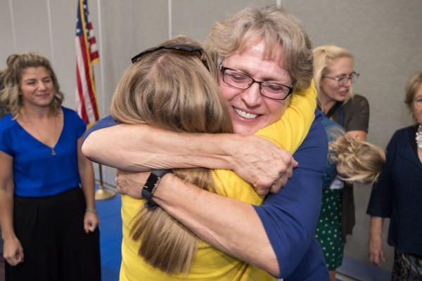 Melody Mansfield 2017 Notification hugs colleagues
